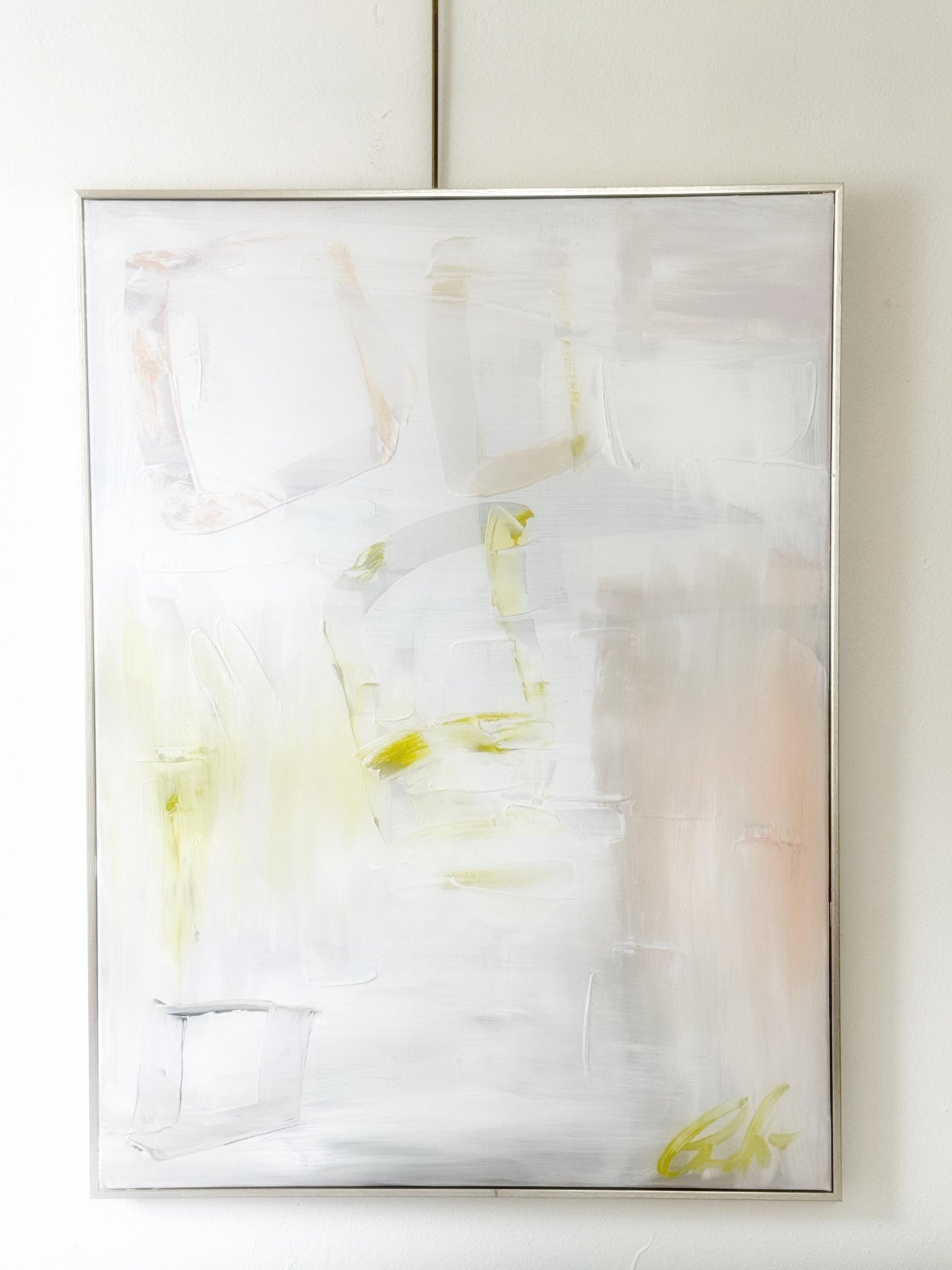 Original abstract mixed media painting on 24x36 inch canvas with neutral pastel tones framed in silver