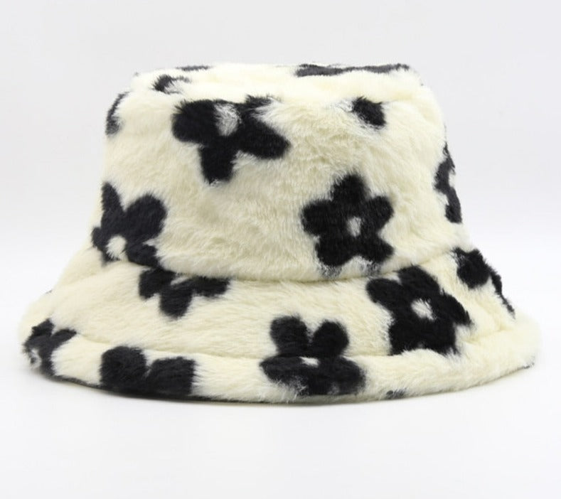 Women's faux fur bucket hat with black flower print and wide brim