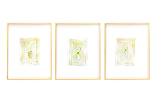 Set of 3 framed abstract watercolor paintings with light pastel colors in gold gallery frames