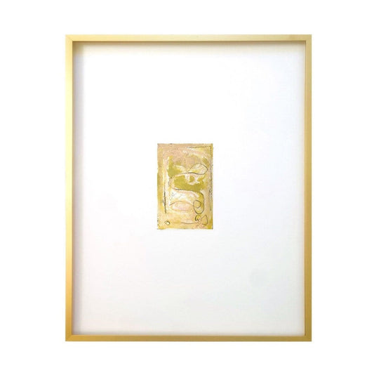 Framed artwork of abstract watercolor on paper with white mat and gold metal gallery frame